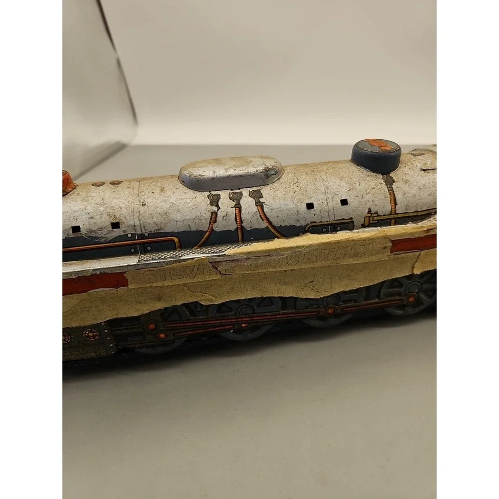 Vintage Over Lane Express and Silver Mountain Tin Train Engines‎